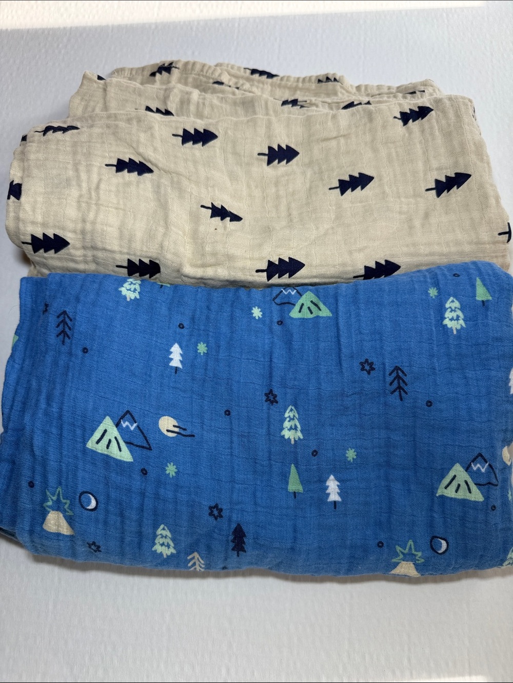 cloud island Blue Baby Muslin Swaddle with Green and Navy Print